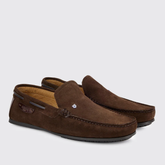 Pair of brown suede loafers on a light grey background