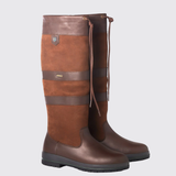 Pair of brown leather knee-high boots on a light grey background
