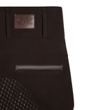 Close-up of a brown leggings with a brand patch on a white background