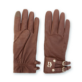 Pair of brown leather gloves with gold buckles on a white background
