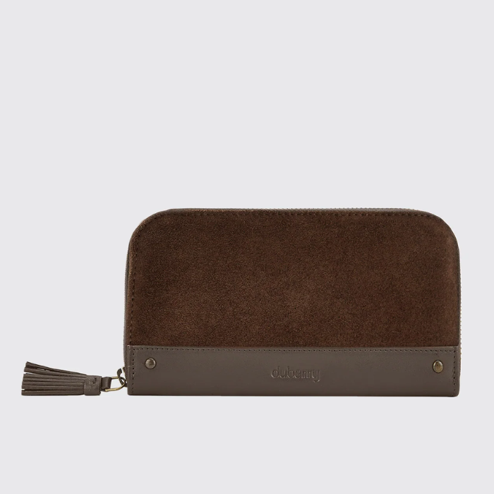 Brown wallet with tassel on a light grey background