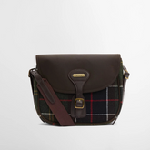 Brown leather and tartan fabric bag on a light grey background
