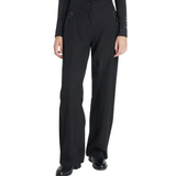 Black waterproof trousers worn against a white background