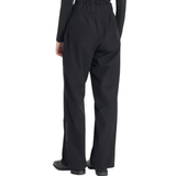 Black waterproof trousers worn against a white background