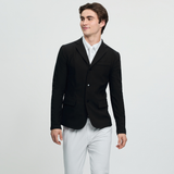 Man wears a black smart jacket with white breeches on a grey background