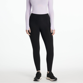 Person wearing black leggings and a light purple long-sleeve top on a white background