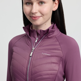 Person wearing a pink quilted jacket with 'LeMieux' branding on a light grey background