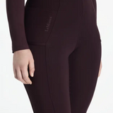 Dark purple riding leggings with a visible LeMieux brand logo on a white background