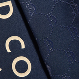 Navy fabric with gripping material and gold letting