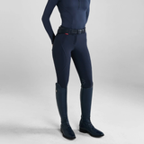 Person wearing navy riding breeches and boots on a white background