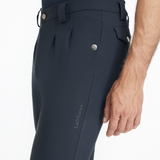 Close-up of a man wearing navy equestrian breeches on a white background