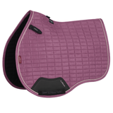 Pink quilted saddle pad on a white background