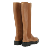 Pair of brown knee-high boots on a white background