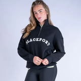 Person wearing a black sweatshirt with 'BLACKFORT' text on a light grey background