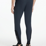 Man wearing navy equestrian breeches on a white background