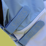 Velcro straps with shires branding on blue fabric