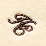 Cream fleece material with HC embroidery