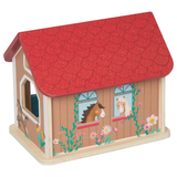 Wooden toy stable with red roof and horse designs on a white background