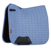 Blue quilted saddle pad with black corners on a white background