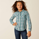 Young girl wearing a blue plaid shirt and jeans on a beige background