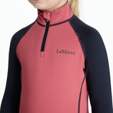 Close-up of a pink and black equestrian shirt with 'LeMieux' branding on a white background.