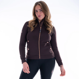 Woman wears a brown sweater with rose gold zip on a white background