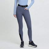 Person wearing blue-grey riding leggings with a black belt on a white background