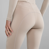 Beige breeches with a grip pattern on a grey background