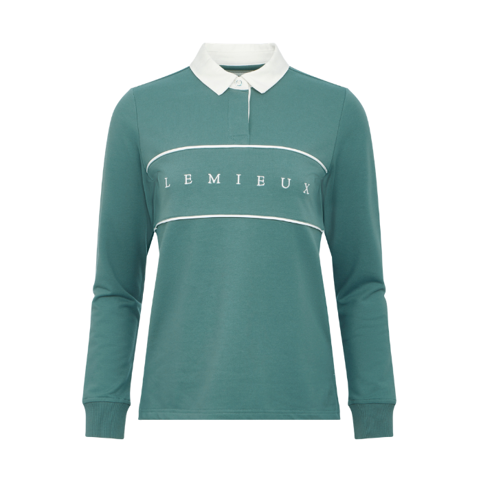 LeMieux AW26 Rochelle Rugby Shirt Variant Colour Aloe.
A long-sleeve polo shirt in teal green with a white collar, featuring a white horizontal stripe across the chest with the brand name 'LEMIEUX' printed in white.
