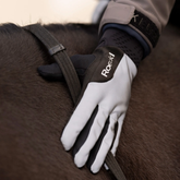 White equestrian glove with black accents on a horse's back