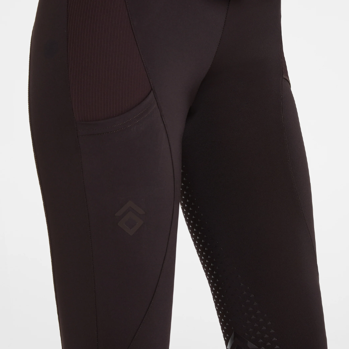 Aztec Diamond AW26 Core Leggings Full Seat Variant Espresso. Close-up of brown athletic leggings with a side pocket and textured grip panels on the lower leg, shown against a plain light background.