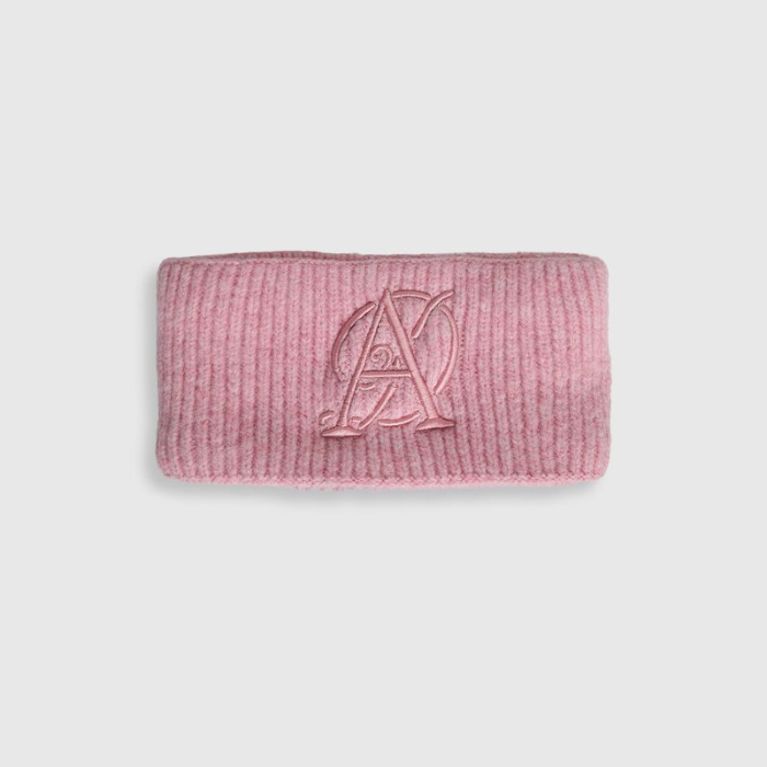 Pink textured pouch with a logo on a light gray background