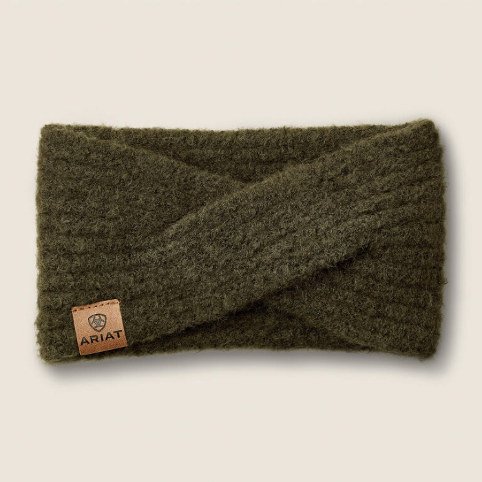 Ariat Ladies Chilton Headband Variant Olive. An olive green ribbed knit twist-front ear warmer with a small brown leather brand patch on the lower left, shown on a light beige background.