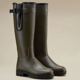 Le Chameau Ladies Vierzonord Neoprene Lined Wellies Variant Chameau Green. A pair of dark olive green rubber rain boots with black soles and a black strap detail on the outer side, displayed against a solid beige background.