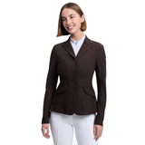 Woman wearing a brown equestrian jacket and white pants on a white background