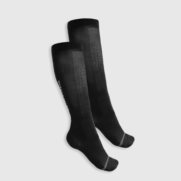 Black knee length socks white background