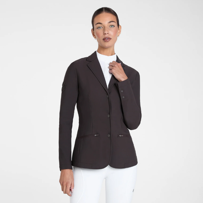 Aztec Diamond Competition Jacket Variant Espresso. Woman wearing a Brown fitted competition jacket with White breaches on a white background. 