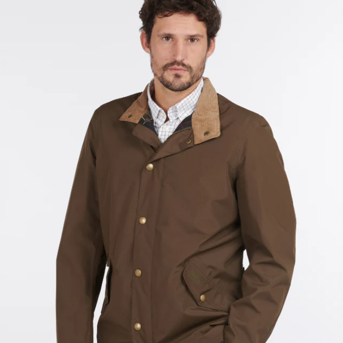Man Wears Barbour Men's Spoonbill Jacket in Dark Olive