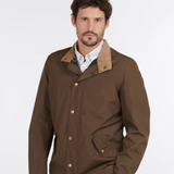 Man Wears Barbour Men's Spoonbill Jacket in Dark Olive