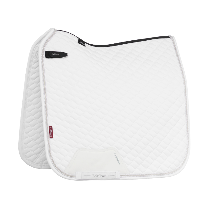 White saddle pad with black border on a white background