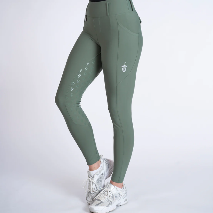 Green riding pants with white accents on a white background