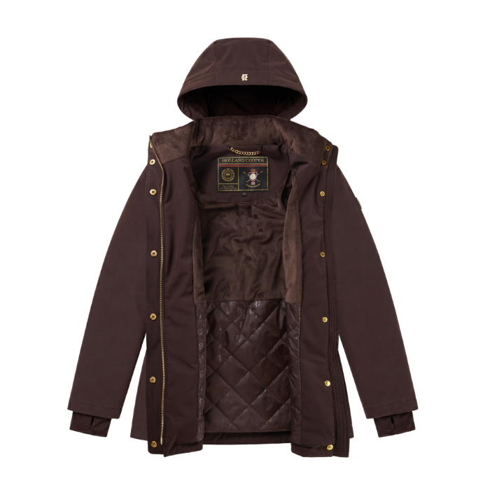 Holland Cooper Essential Waterproof Jacket Variant Bournville. A dark brown hooded parka jacket with gold-tone snap buttons and a quilted interior lining, displayed against a solid white background.