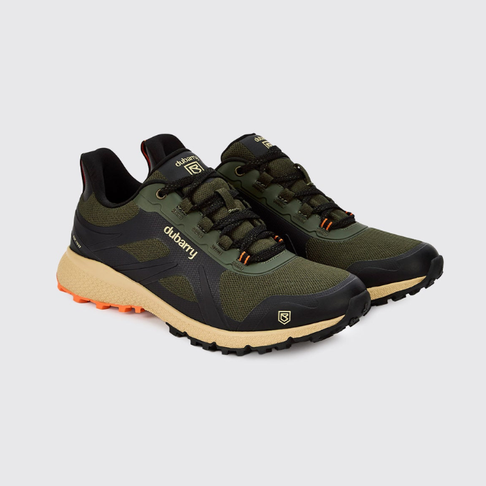 A pair of outdoor trail shoes in olive green and black with beige midsoles and orange outsole accents, displayed on a light gray background.