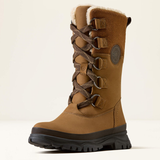 Ariat Wetherby H20 Insulated Variant Dark Earth. A mid-calf brown winter boot with a soft white shearling lining, brown laces, metal eyelets, and a rugged black sole, shown against a plain light beige background.