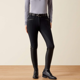 Black breaches with a purple base layer and long black boots against a beige background. 