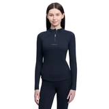 Person in navy long sleeve 'LeMieux' top and leggings on white background