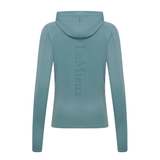LeMieux AW26 Heidi Hooded Mid Layer Variant Colour Aloe.
A long-sleeve hooded athletic top shown from the back. The brand name 'LeMieux' is printed vertically in a matching colour on the back center.