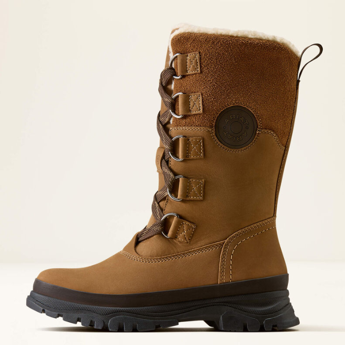 Ariat Wetherby H20 Insulated Variant Dark Earth. A mid-calf brown suede and leather lace-up boot with a black rugged sole and a soft white shearling lining, shown against a plain off-white background.