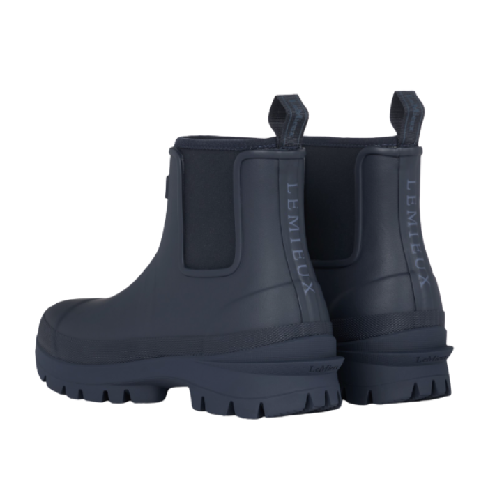 LeMieux AW26 Bramshaw Chelsea Welly Varient Navy. A pair of dark navy blue rubber rain boots with 'LeMieux' on back, shown from a three-quarter rear angle on a white background.