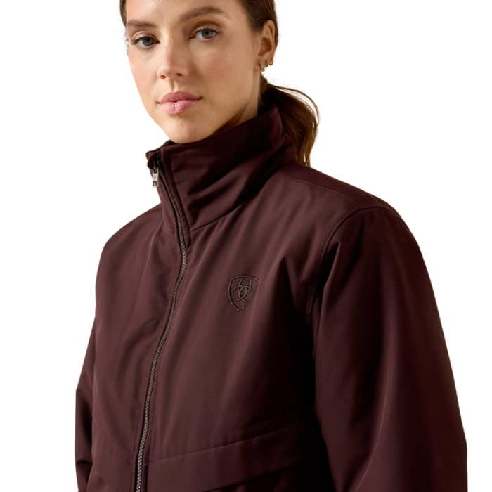 Ariat Women's Stable 2.0 Insulated Jacket Varient Chocolate Plum. Woman wearing a brown bomber coat on a white background.